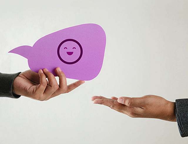 Customer Experience Concept. Happy Client giving a Smiling Emoticon to a Businessman. Feedback on Bubble Speech Card. Positive Review. Satisfaction Survey